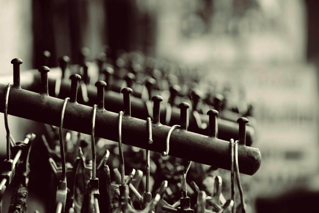 Round rack dividers by Mark Bric Sizers efficiently organize apparel sizes in retail stores.
